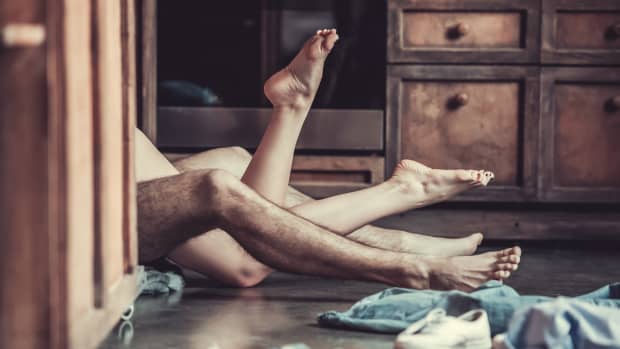 the legs of couples having sex on the kitchen floor
