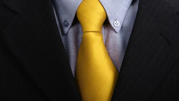detail of a Business man Suit with yellow tie